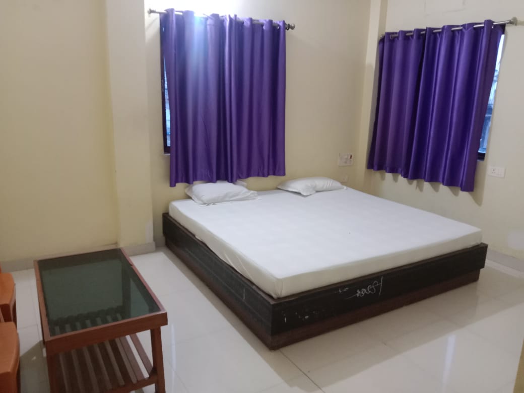 Spacious double bed room with large windows at Happy International Guest House